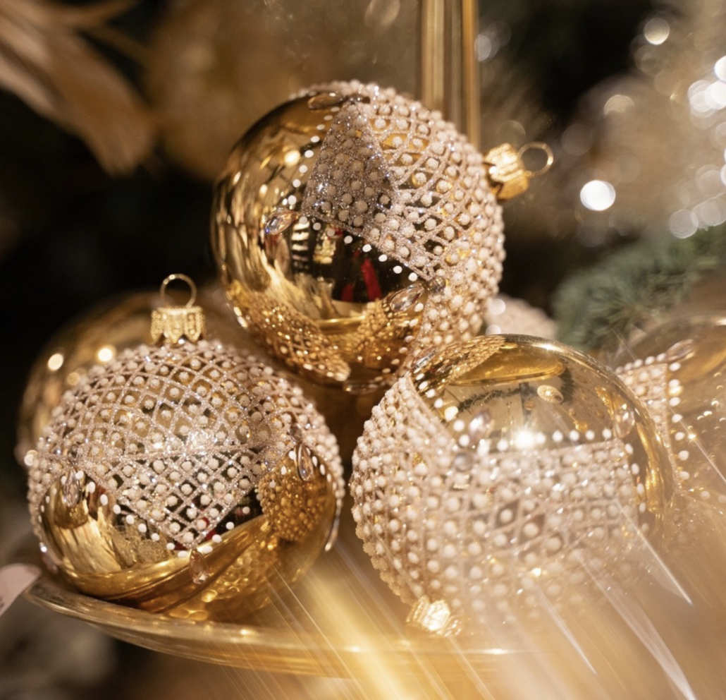 Golden Christmas baubles Gold Christmas baubles decorated with white glitter patterns
