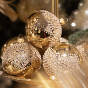 Golden Christmas baubles Gold Christmas baubles decorated with white glitter patterns