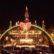 Vienna Christmas Market at Rathausplatz Vienna City Hall and the illuminated entrance to the Christmas market at night