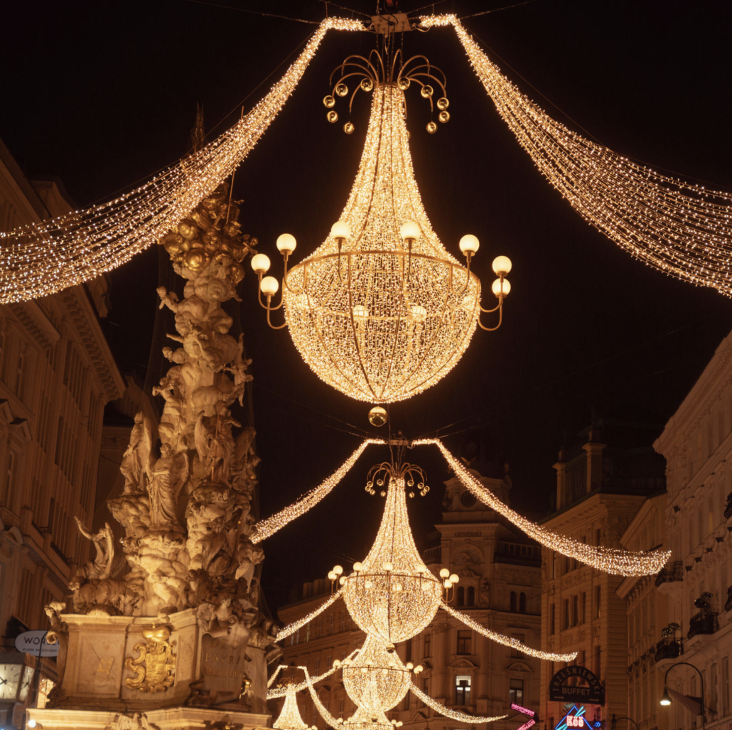 Christmas chandeliers and the Plague Column Golden Christmas chandeliers beside the Plague Column on Vienna’s Graben