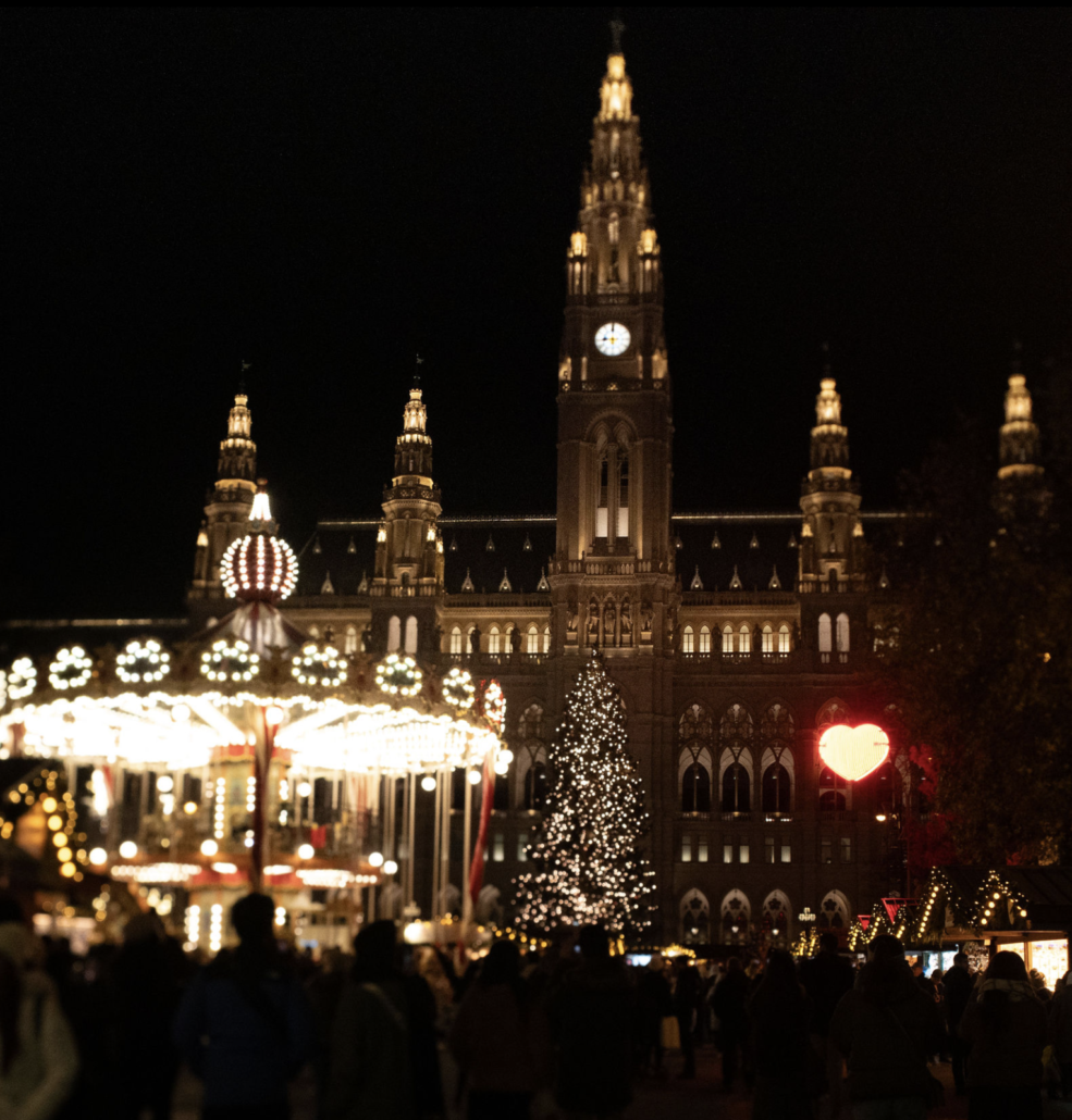 Christmas at Vienna City Hall Illuminated carousel and Christmas tree in front of Vienna City Hall at night